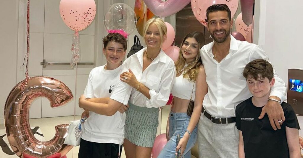 woman, man, and kids smiling 