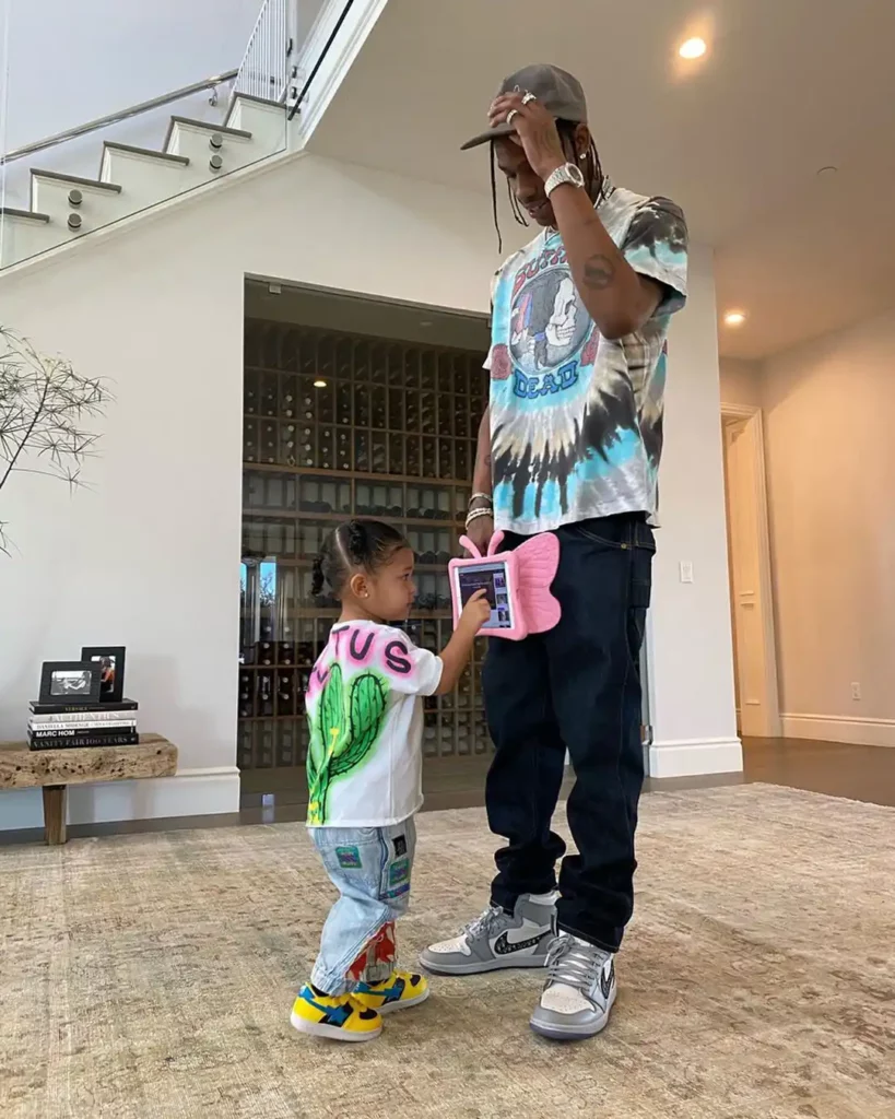 man and small girl posing in matching shirts