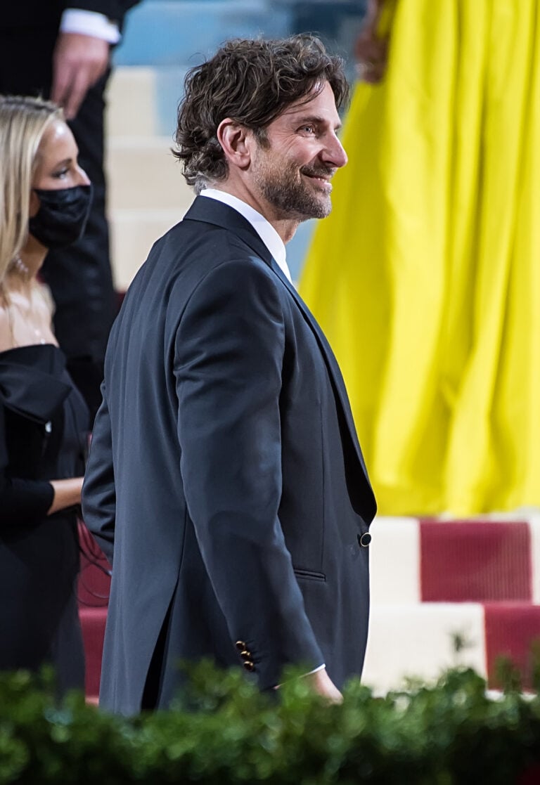 Bradley Cooper in a dark suit at a formal event