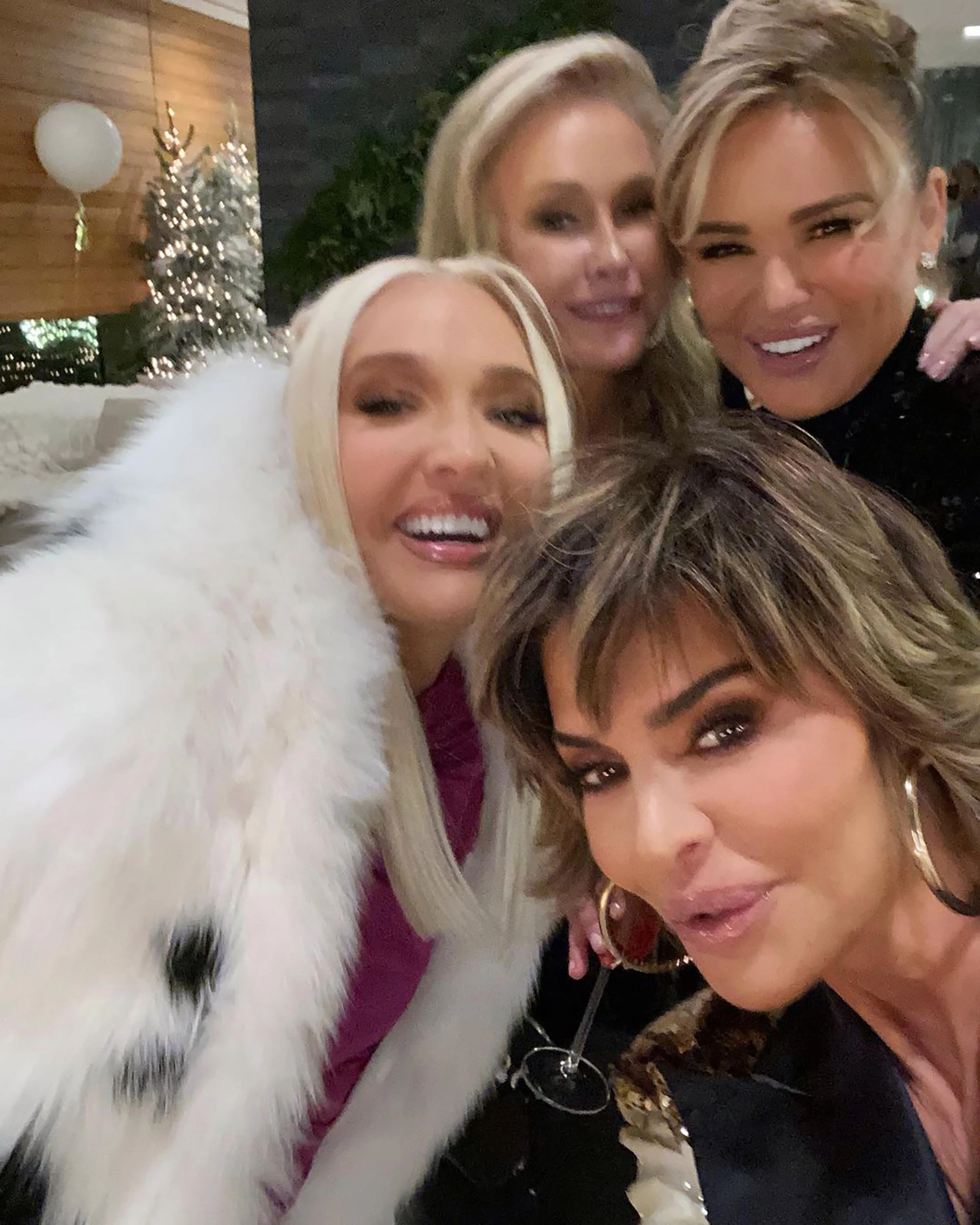 a group of women smiling for a photo