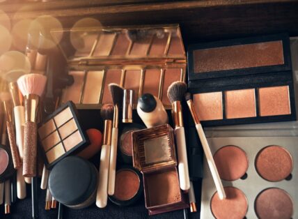 A collection of makeup brushes and palettes.