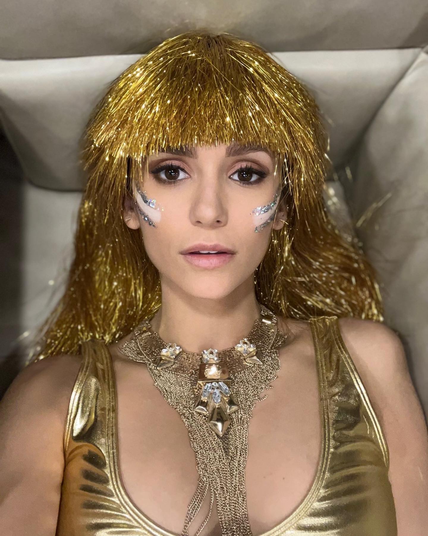 Nina Dobrev in her gold costume at Burning Man 2022