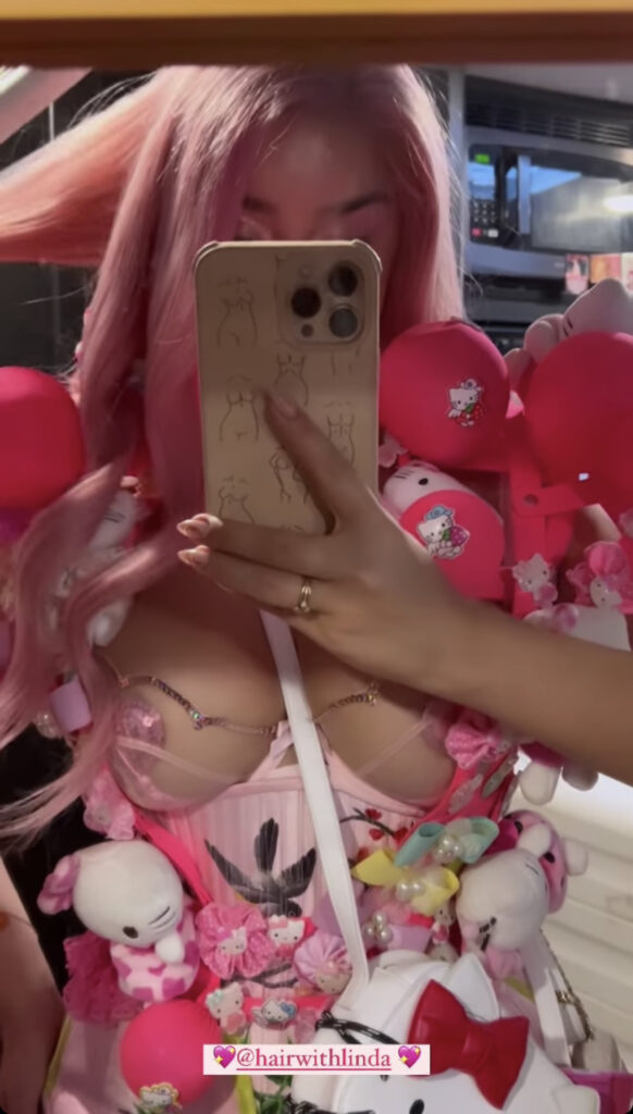 Demi Rose taking a selfie.