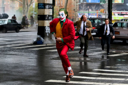 Joaquin Phoenix in full Joker costume and make-up filming dangerous stunt action scene in New York City, Joker 2