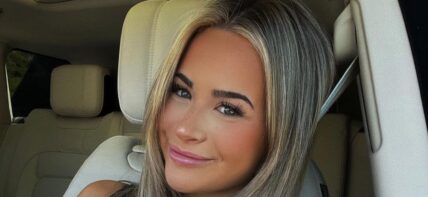 Emily Elizabeth takes a selfie inside her car.