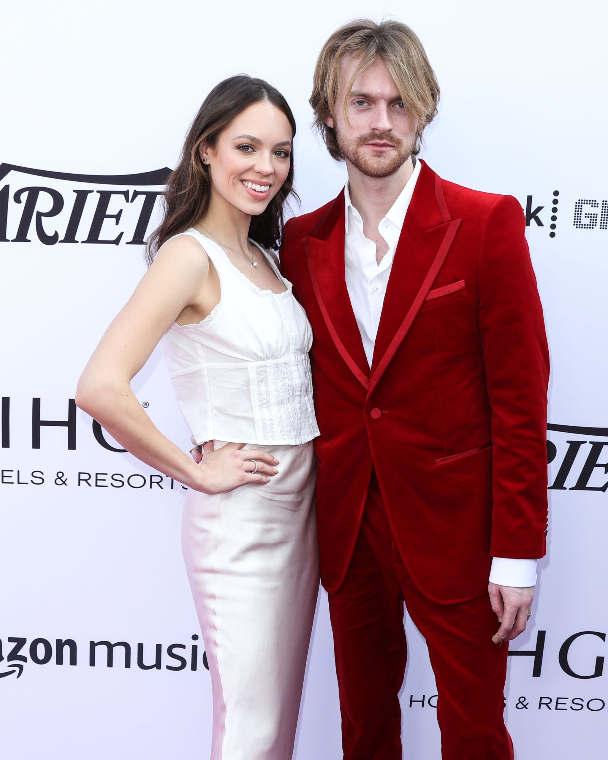 Claudia Sulewski and Finneas O'Connell on the red carpet