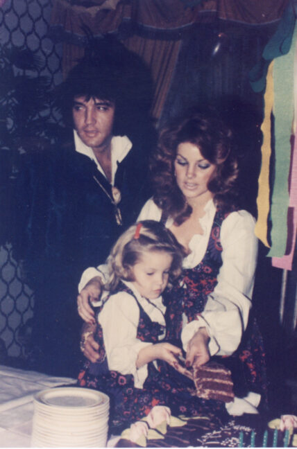 Portrait of Elvis & Priscilla Presley with their daughter