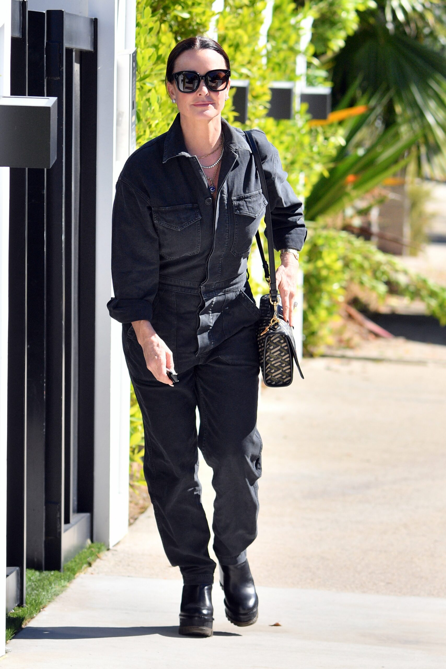 Kyle Richards is seen leaving the home of RHOBH star Dorit Kemsley who was reportedly held at gunpoint by 3 men and robbed of jewelry and handbags during 20-minute home invasion