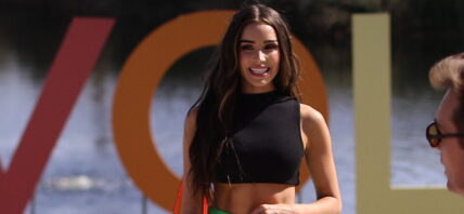 Olivia Culpo plays Jenga during Coachella party as she poses by the pool on final day in Indio