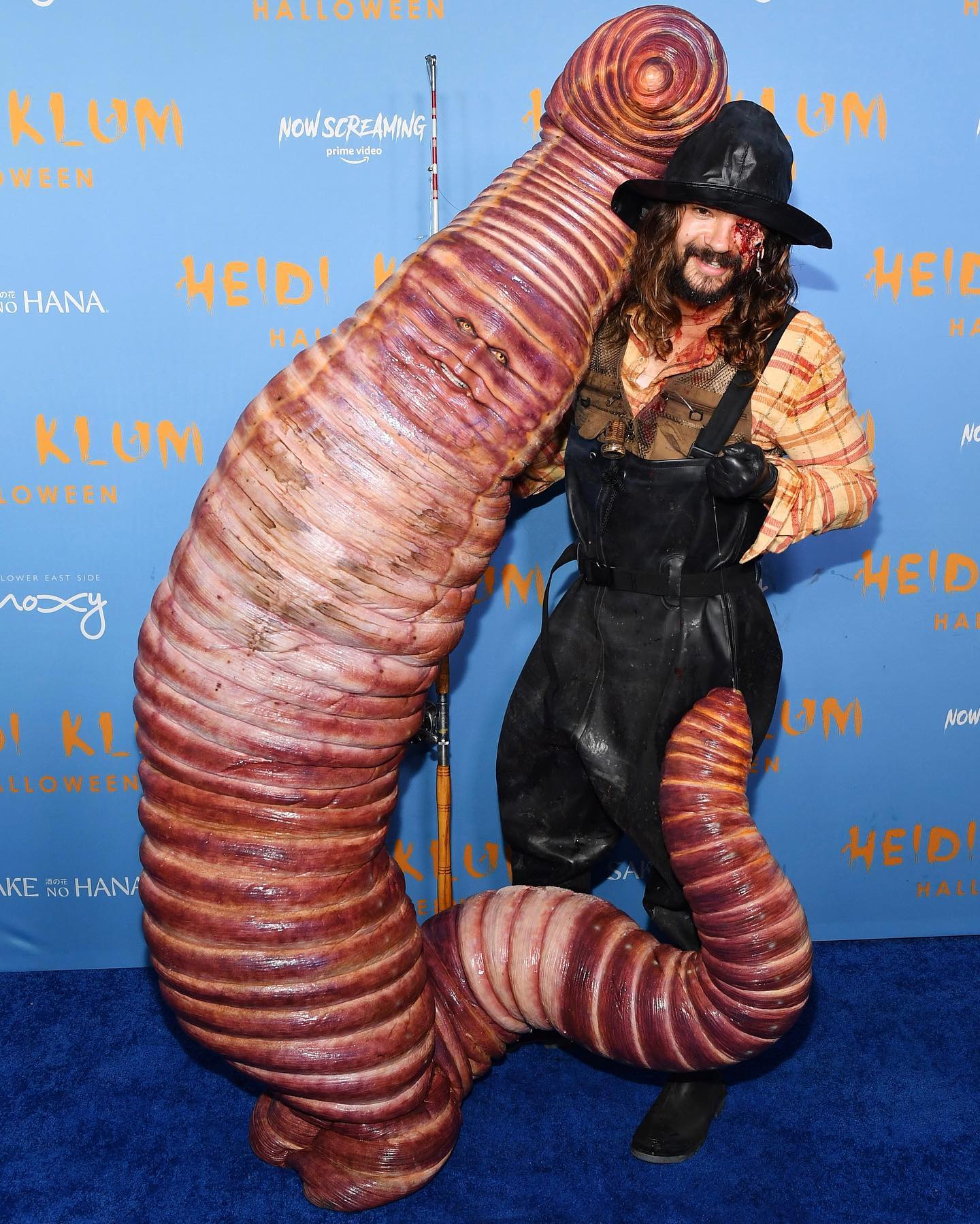 Heidi Klum and Tom Kaulitz pose as a worm and a fisherman for Halloween