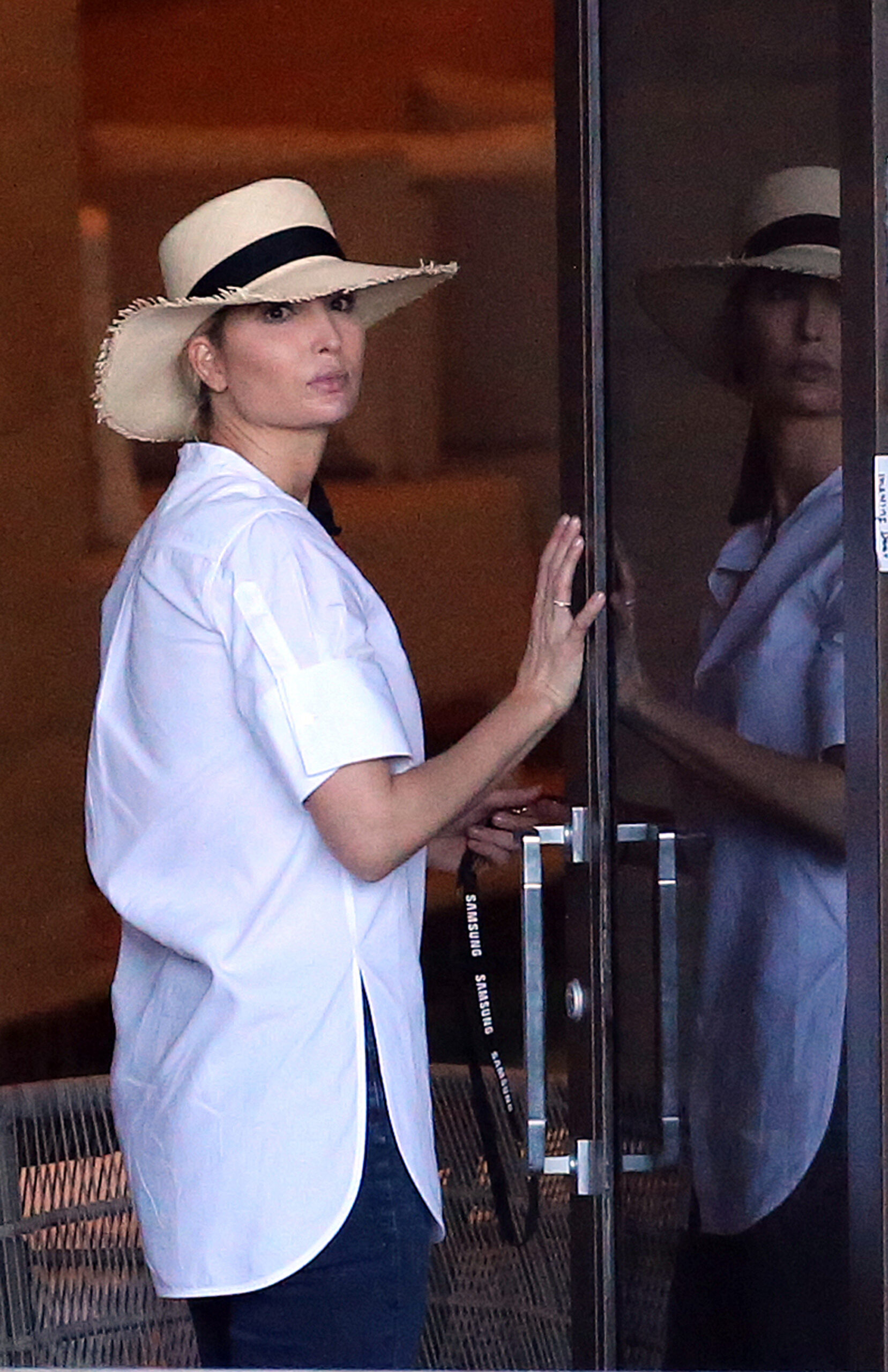 Ivanka Trump helps her daughter with a huge unicorn float as she takes her kids down to the pool after school in Miami