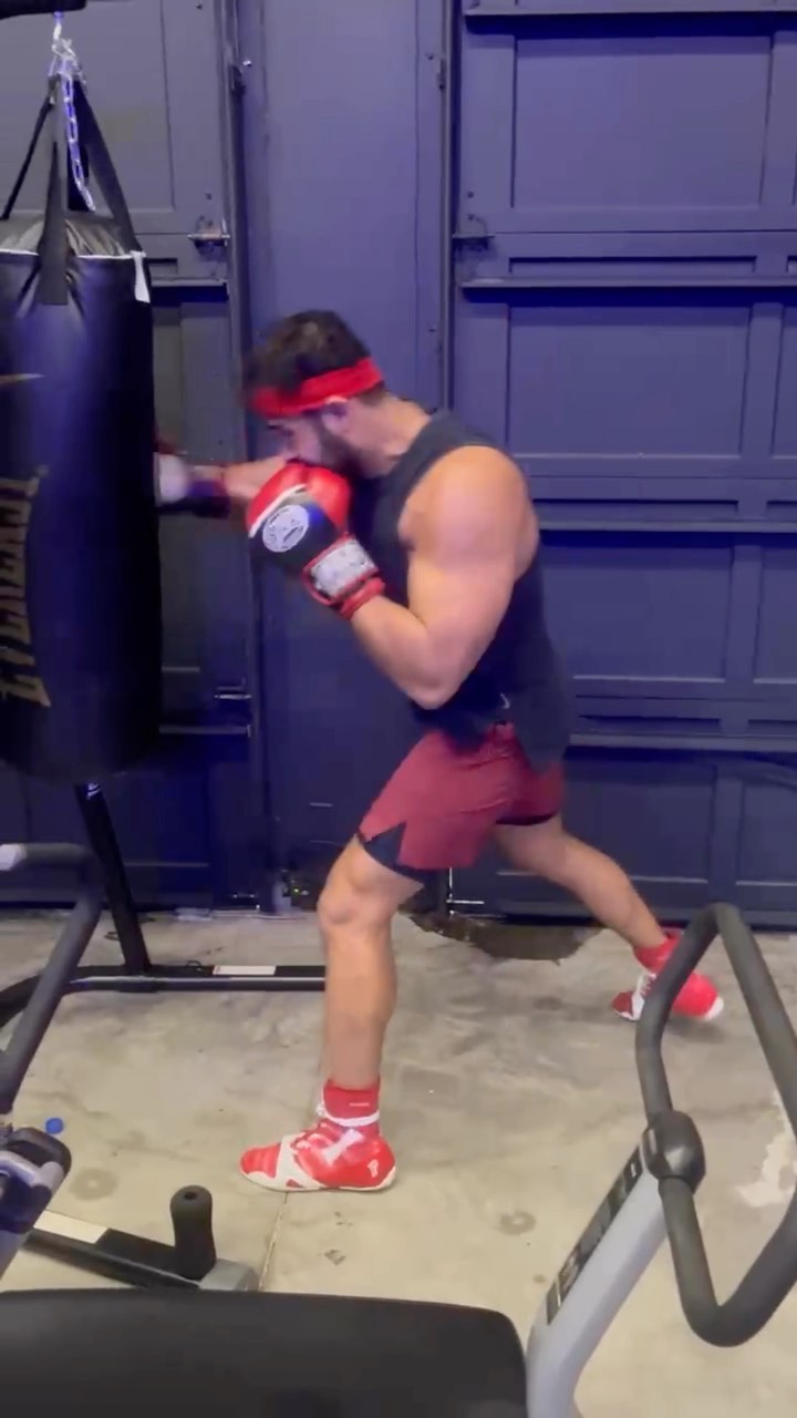 Sam Asghari boxes while Britney Spears watches