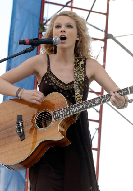 Taylor Swift performs live earlier in her career at KISS Country Chili Cookoff 2008 in Pembroke Pines Florida
