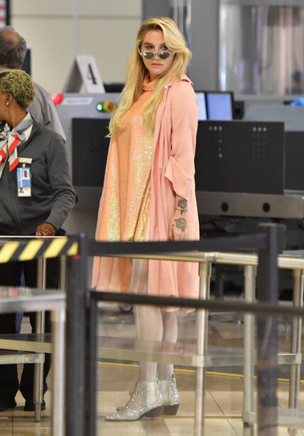Kesha seen heading through security at LAX