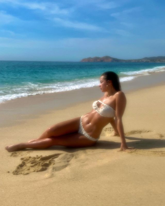 Addison Rae Is A Dreamy Vision Wet And Lying On The Beach