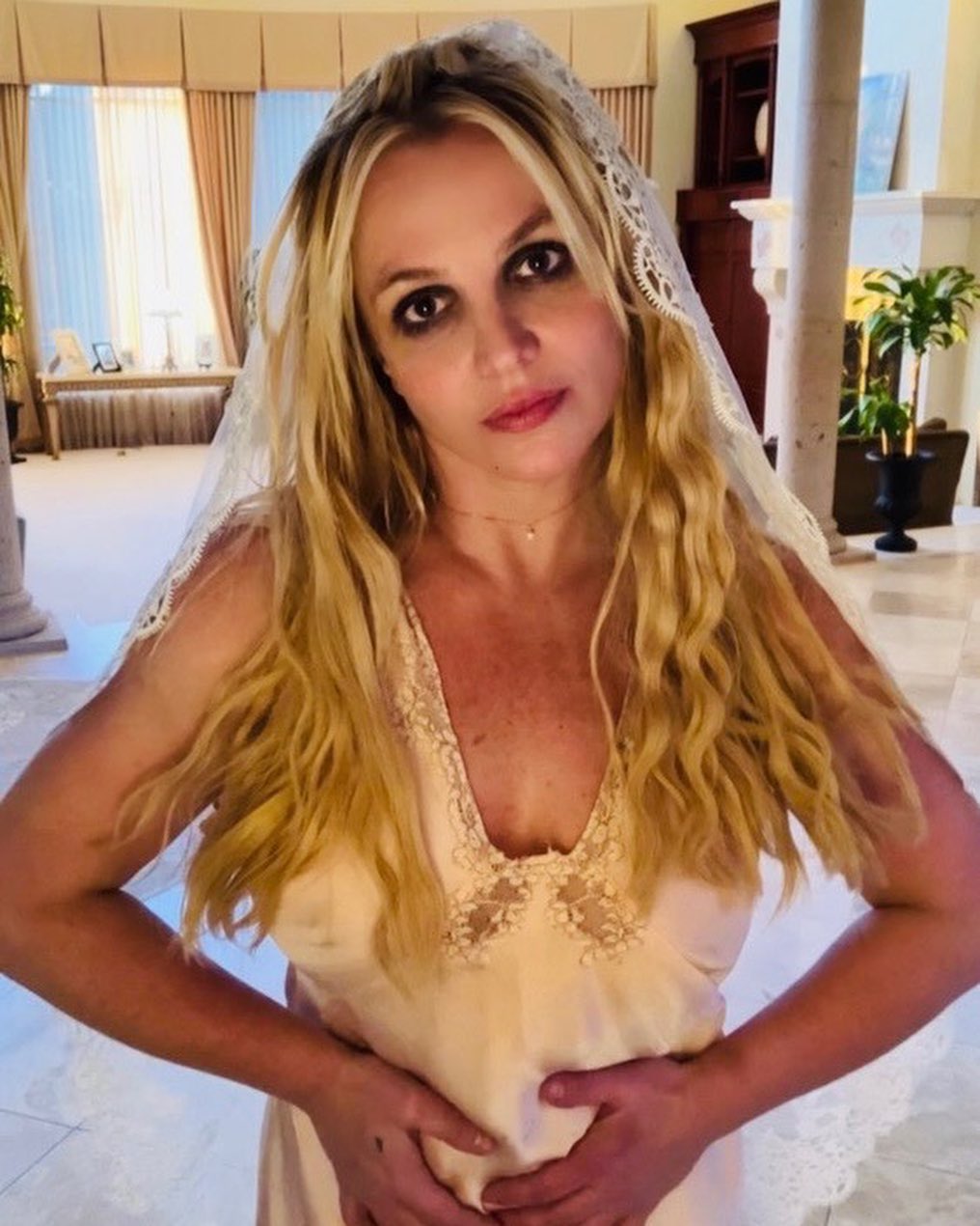 Britney Spears wears a wedding veil