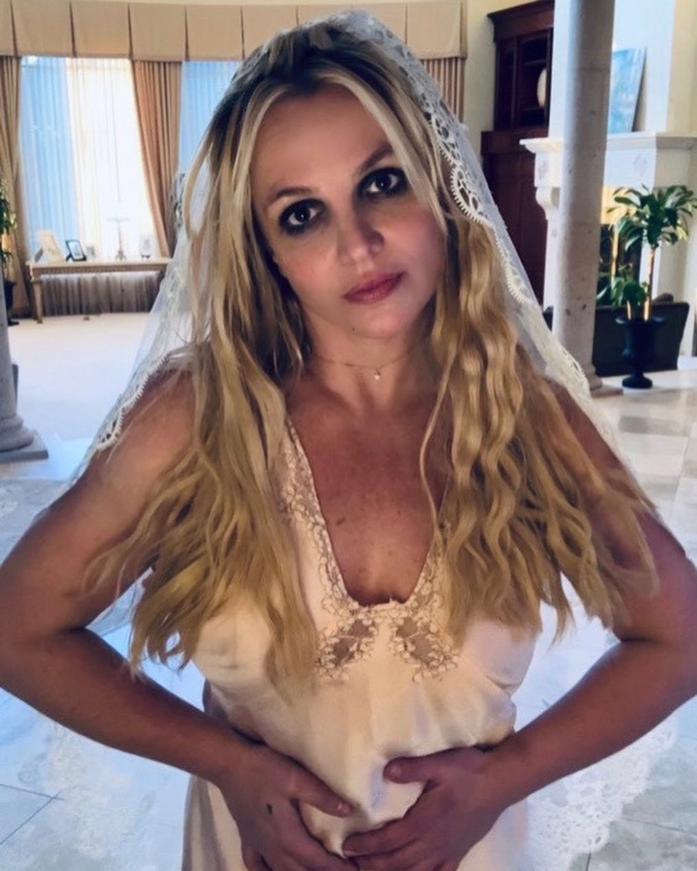 Britney Spears wears a wedding veil