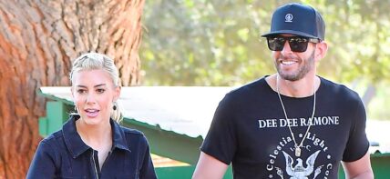 Heather Rae Young and Tarek El Moussa stroll through the Kindred Spirits Care Farm after celebrating her new Peta Campaign