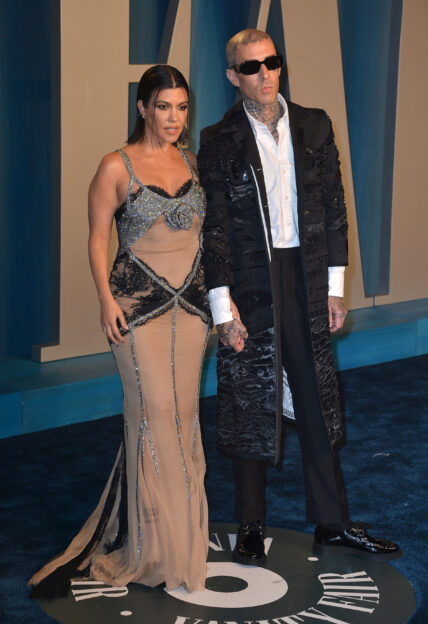 Kourtney Kardashian and Travis Barker at the 2022 Vanity Fair Oscar Party Hosted By Radhika Jones