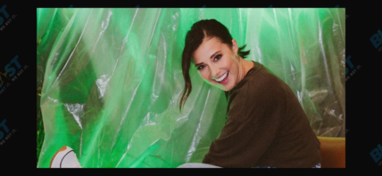 Katie Thurston posing with a disco ball