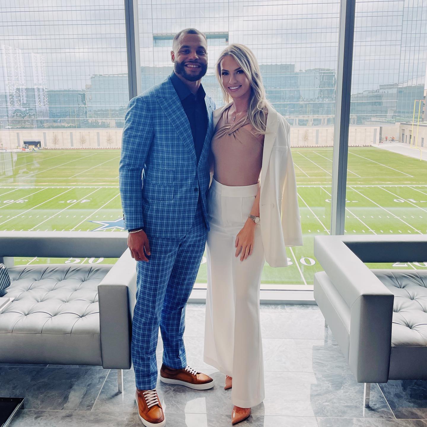 Dak Prescott poses next to Natalie Buffett