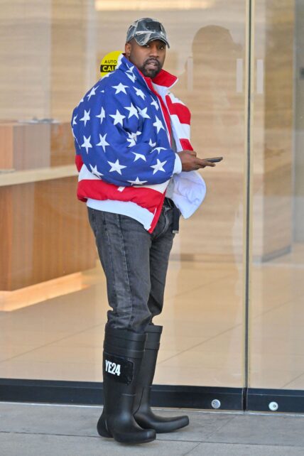 Kanye West heads to a meeting after heading to church wearing an American flag jacket