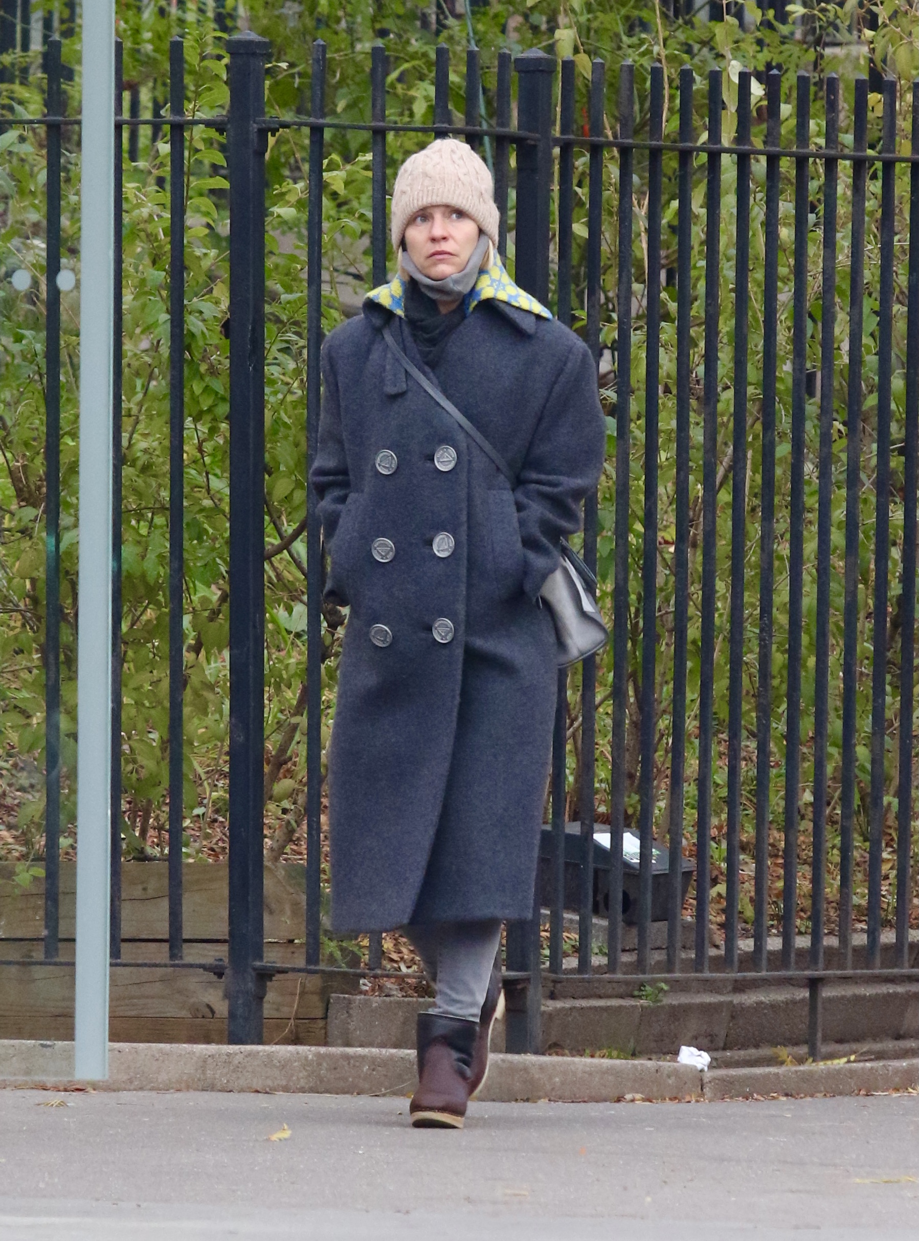 Homeland star Claire Danes almost crashes with a tourist eating a pizza while she makes a run for it to make it across the crosswalk in NYC