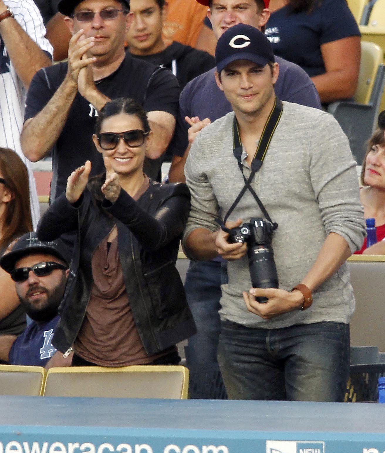 Demi Moore and Ashton Kutcher cheer on a homerun by Yankees Alex Rodriguez