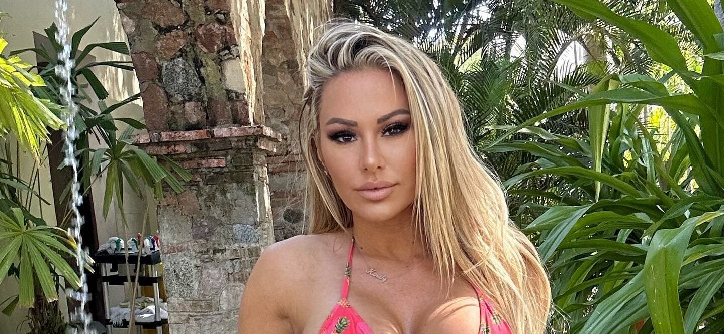 Kindly Myers In Stringy Blue Bikini Brings 'Paradise' To The Beach