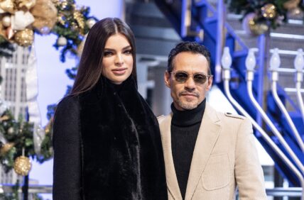 Marc Anthony & Nadia Ferreira pose on grand staircase during visit to Empire State Building