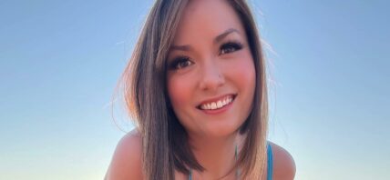 Nikole Mitchell poses in a blue bikini