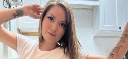 Nikole Mitchell poses in panties and a white shirt