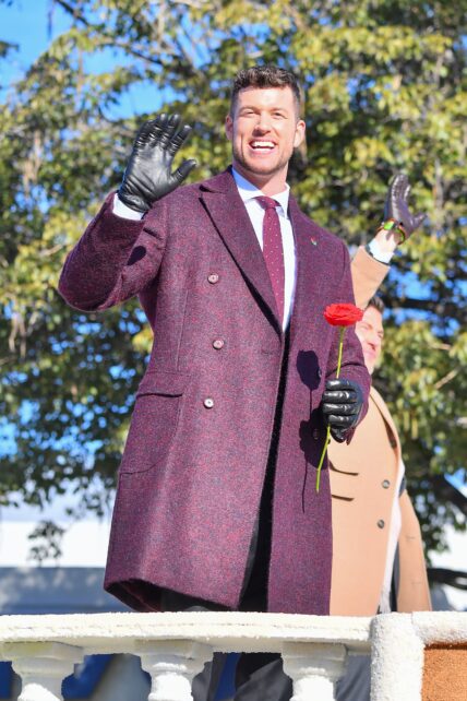 Bachelor Clayton Echard is all smiles while on a parade float in the 2022 Rose Parade in Pasadena Ca