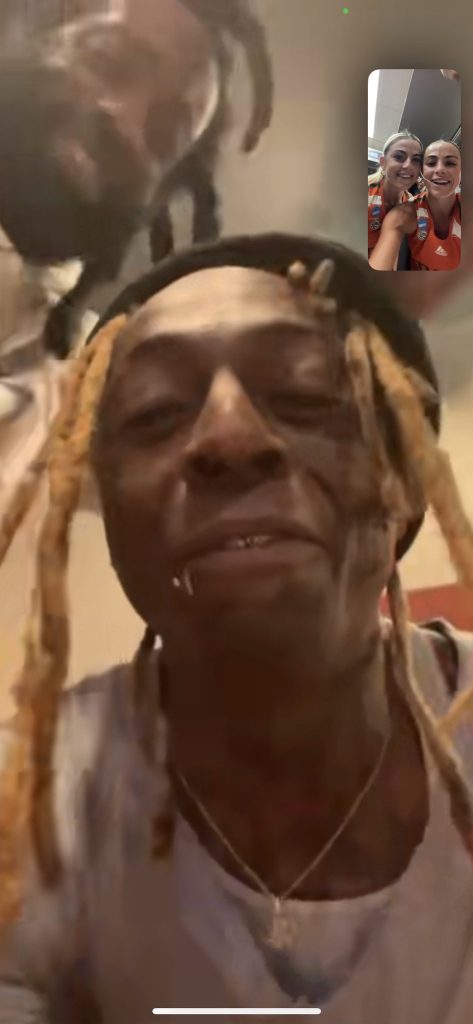 Haley and Hanna Cavinder talking to Lil Wayne over FaceTime.
