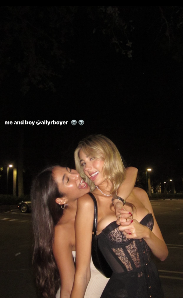 Scarlet Stallone posing for the camera with her friend.