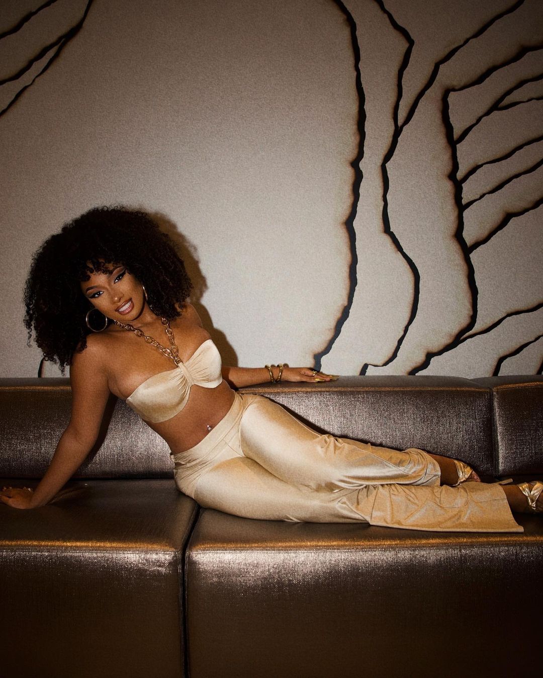 Fans Are Getting Goddess Vibes As Megan Thee Stallion Steps Out In Gold Ensemble