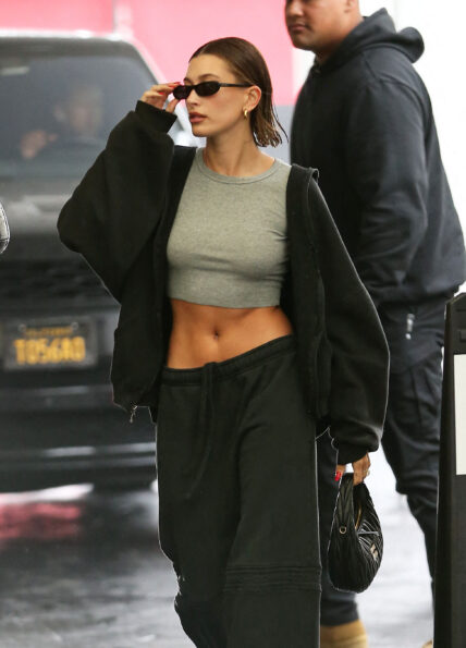 Hailey Bieber is seen running errands in the rain