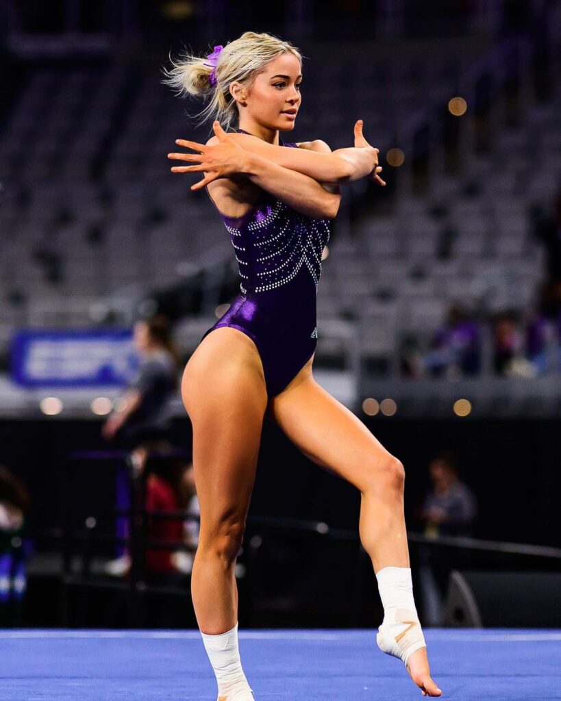 Olivia Dunne standing on the mat.