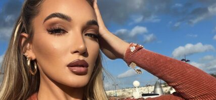 Beaux Raymond goes braless in her orange jumpsuit