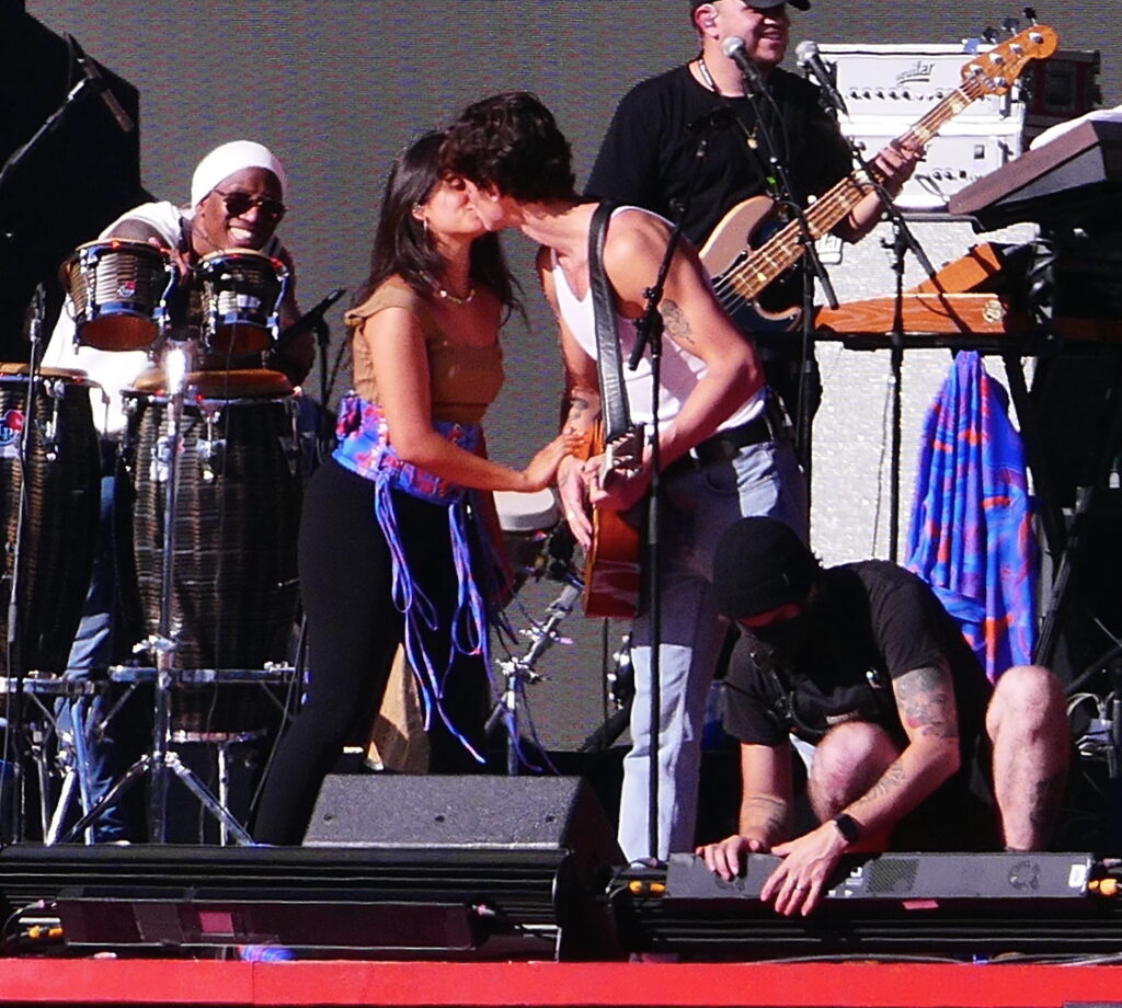 Camila Cabello and Shawn Mendes share multiple kisses as they laugh as stagehand keeps building the set during their romantic soundcheck as fans join in on the laughs as they perform at Global Citizens in the hot sun day before massive event in NYC