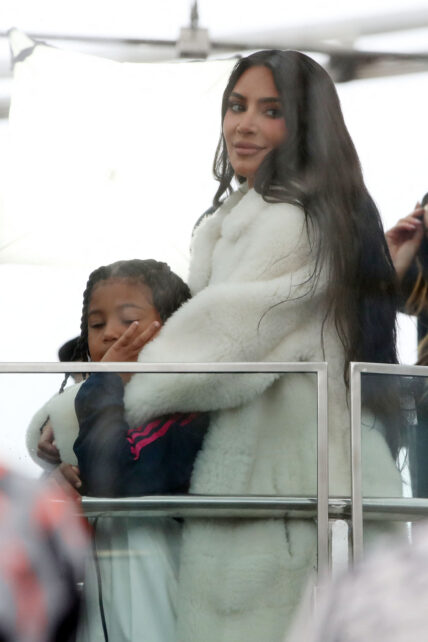 Kim Kardashian seen at a rainy London eye with her kids filming for her new tv series