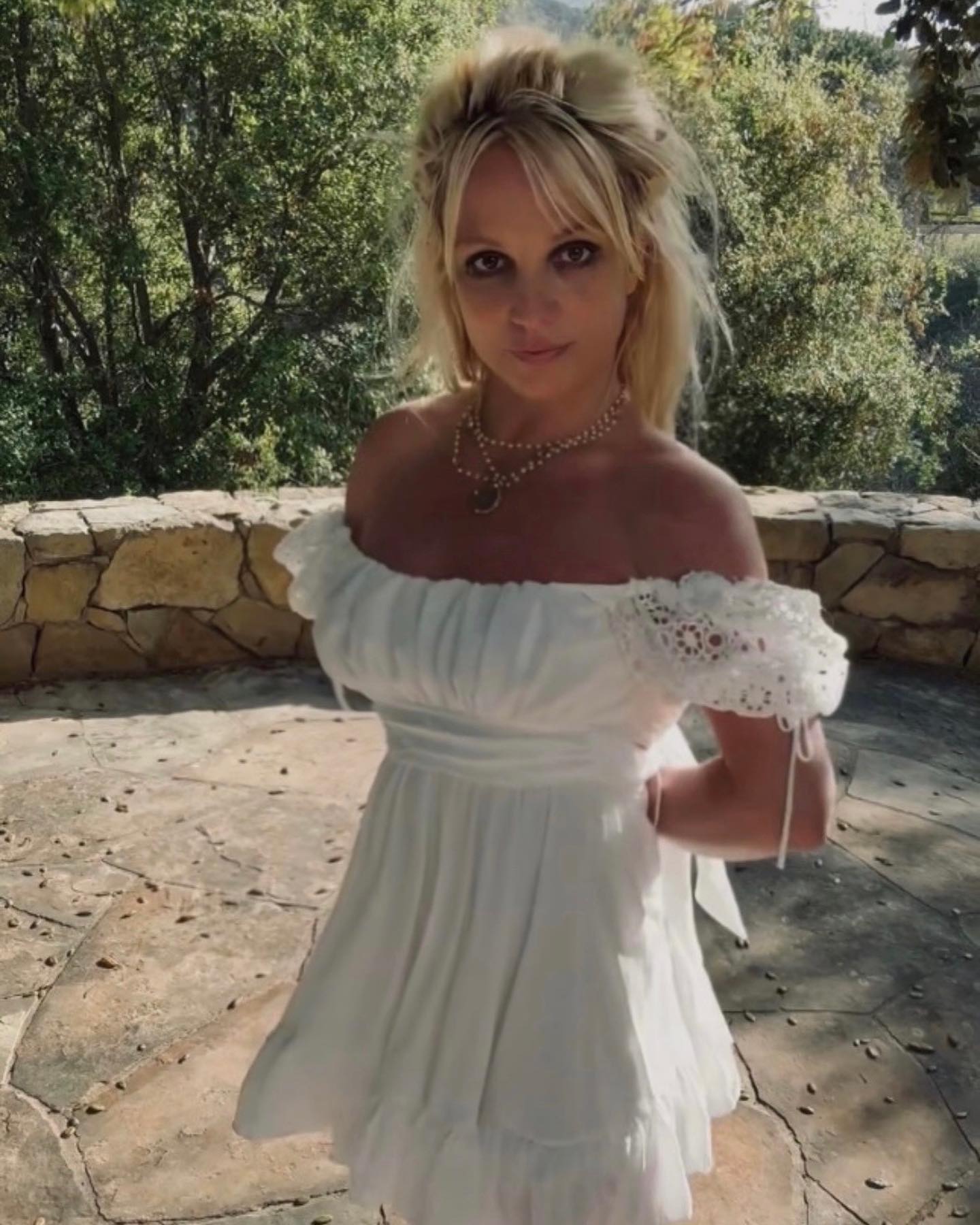 Britney Spears Tugs Down Her Sleeves To Make A Strapless Dress