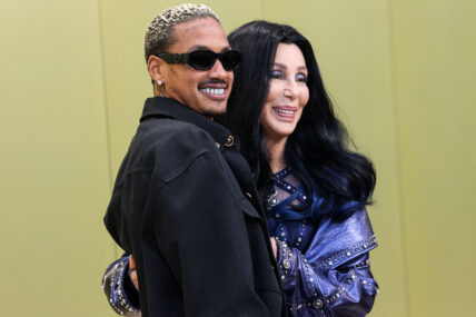 Alexander Edwards and girlfriend Cher arrive at the Versace Fall/Winter 2023 Fashion Show