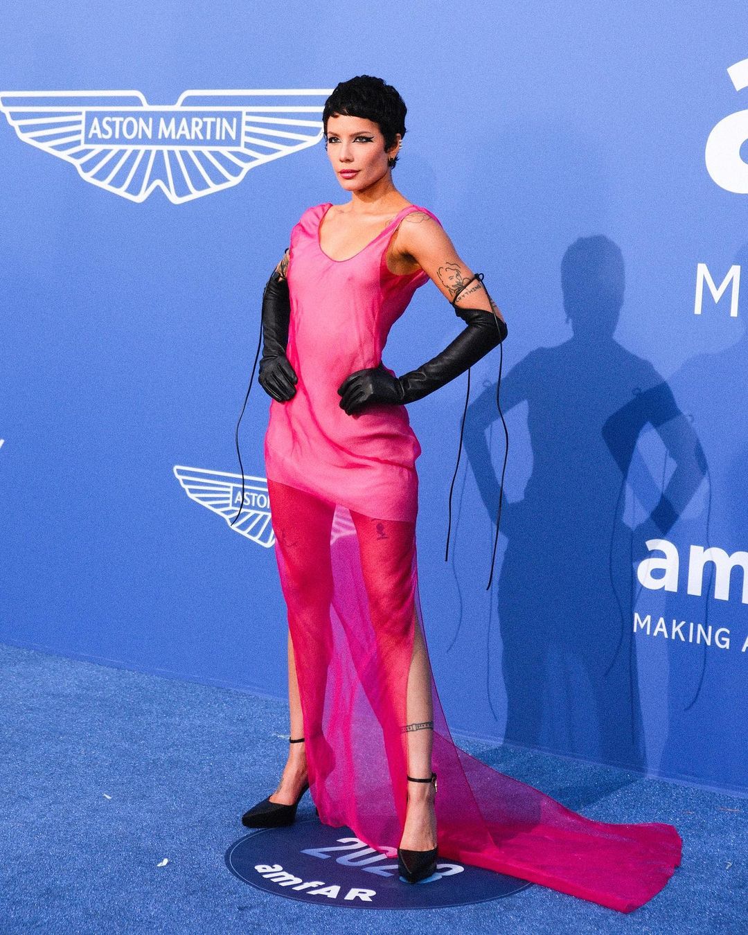 Halsey in neon pink dress at amfAR