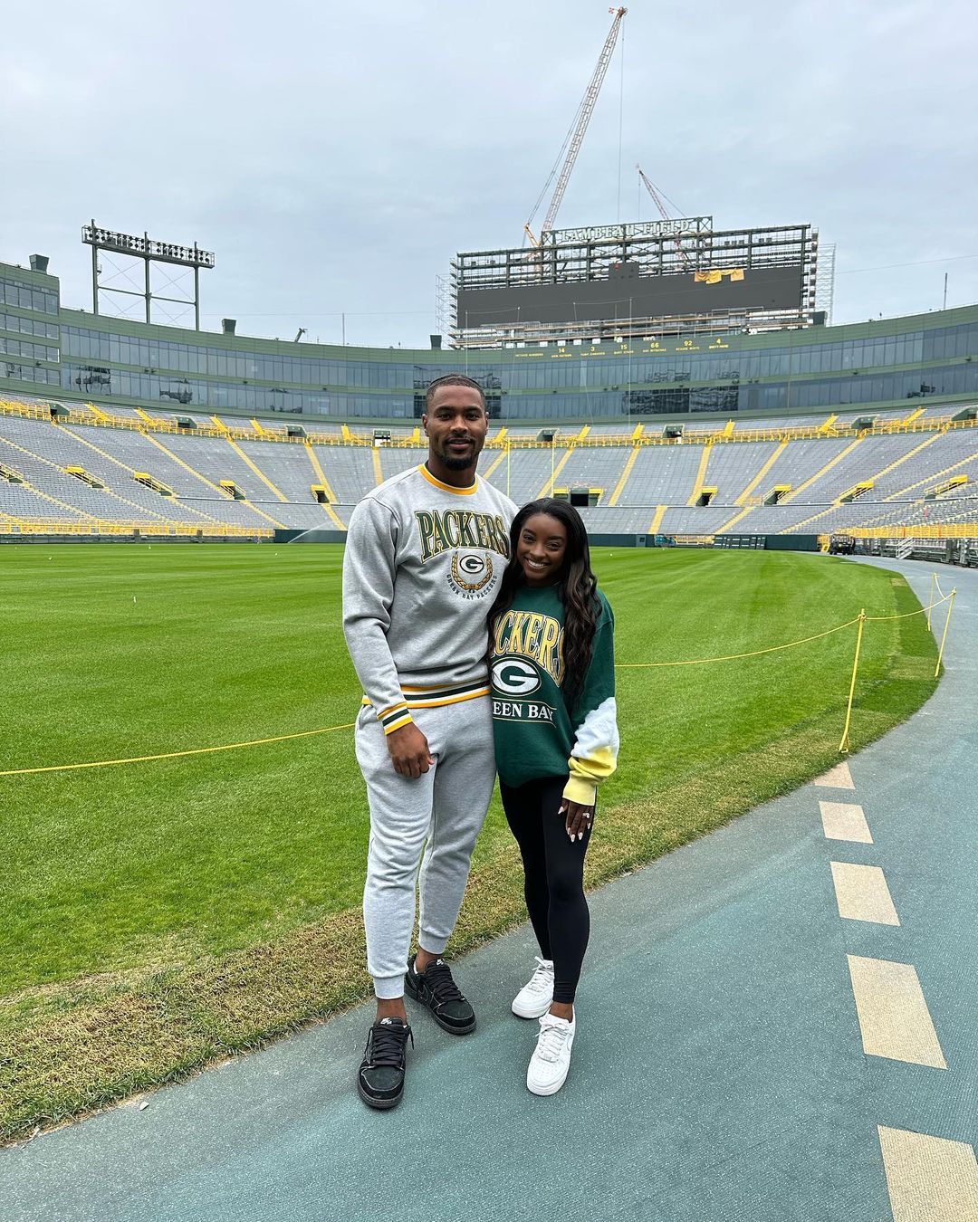 Simone Biles celebrates as Jonathan Owens joins Green Bay Packers