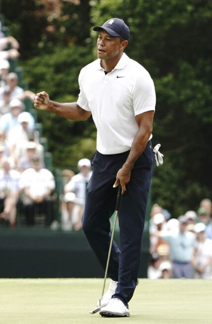 Tiger Woods reacts after making a birdie putt on the 15th hole during the first round of theMasters Tournament at Augusta National Golf Club