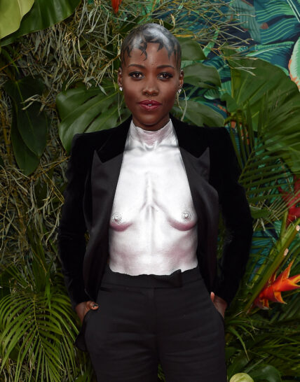 Lupita Nyong'o tries some crunchy grasshoppers