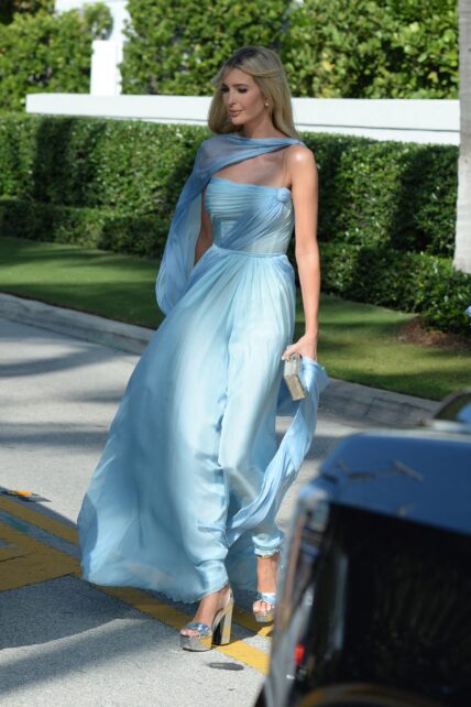 Ivanka Tump wears a flowing baby blue dress as she arrives to sister Tiffany Trump's wedding at Mar-A-Lago in Palm Beach