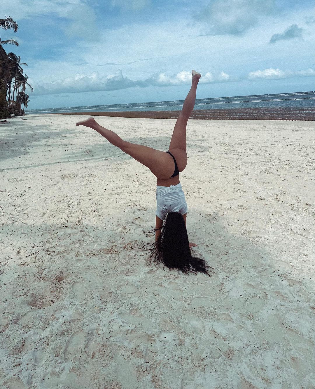 Billionaire Kim Kardashian Does A Cartwheel In A Thong On The Beach 