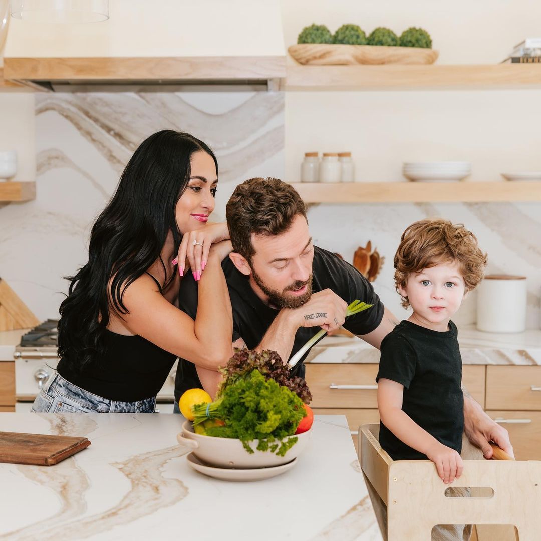 Nikki Bella and Artem Chigvinstev with son Matteo